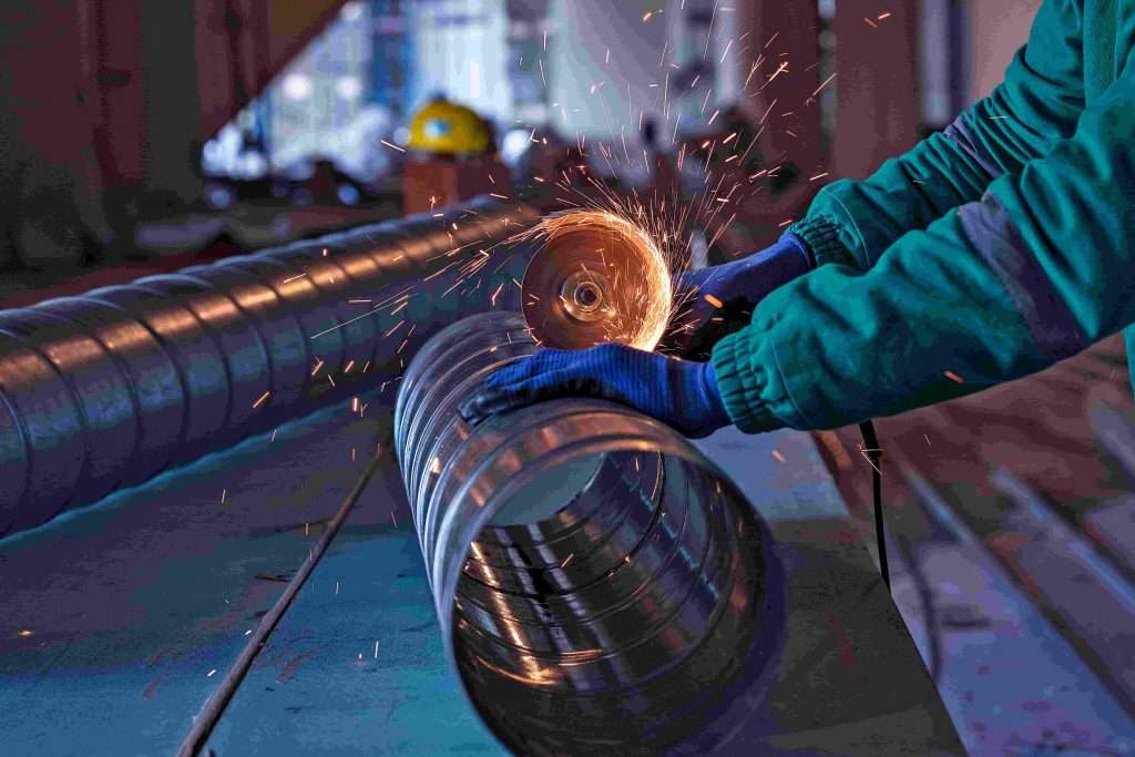 Worker cutting ss material